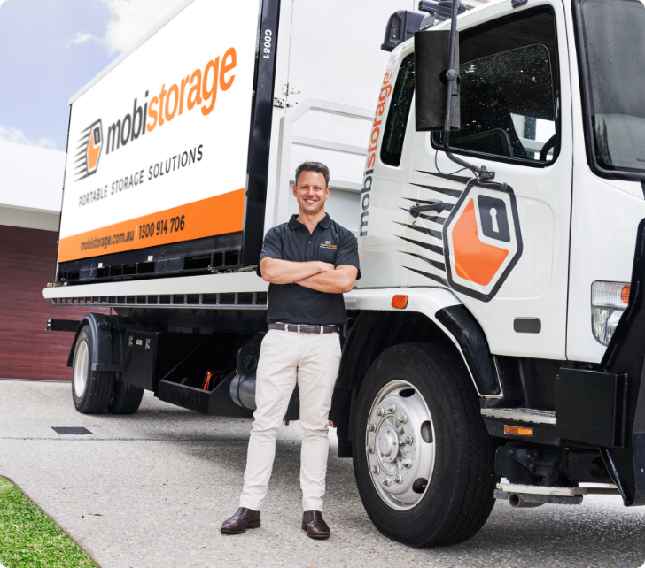 3-MOBI_Driver_&_Truck_0772 (1) man standing in front of mobistorage truck